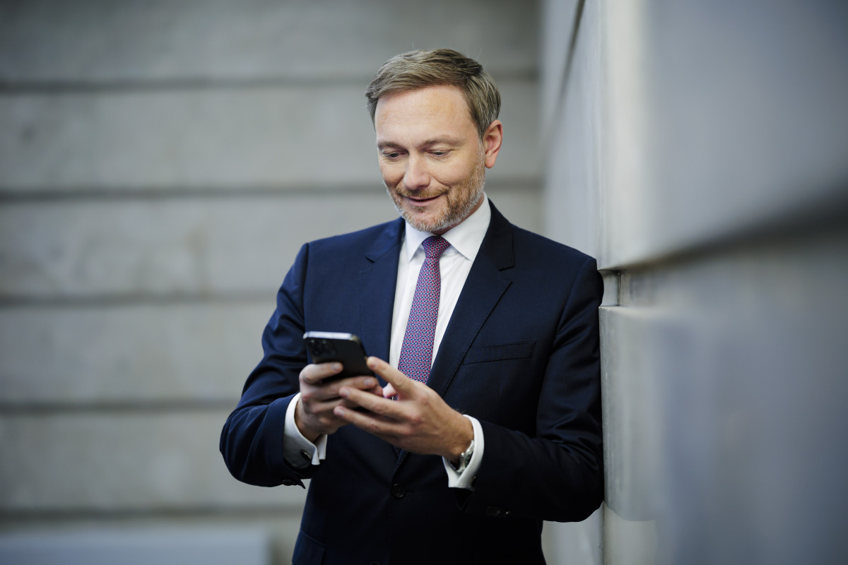 Picture shows German finance minister Christian Lindner on his phone