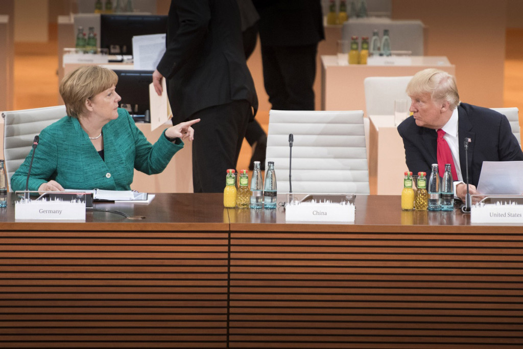 Merkel in conversation with former U.S. president Donald Trump at the G20 summit in Hamburg. Photo: German Government/Bergmann Merkel in conversation with Trump in Hamburg at the G20 summit 2017. Photo: German Government/Bergmann
