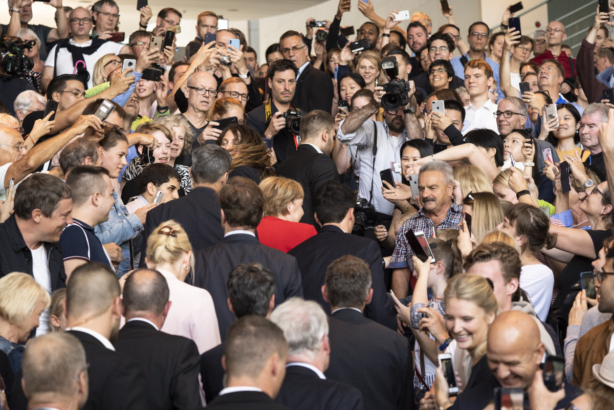 Chancellor Merkel in the crowd at the 2019 open house festivities of the federal government. Photo: Bundesregierung/Plambeck. Photo shows German chancellor Angela Merkel at the open house at her chancellery. Photo: Bundesregierung/Plambeck.