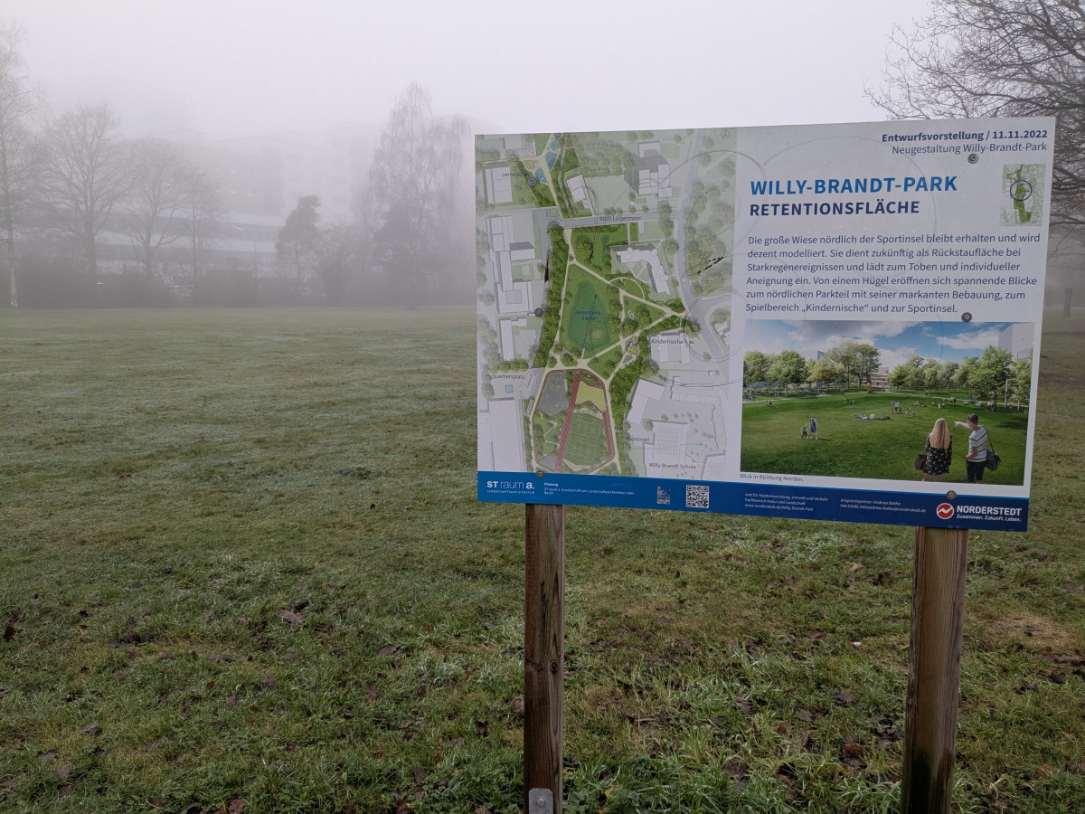 Photo shows board that explains plans to build a water retention area in a park in Norderstedt, Germany. Photo: CLEW/Wettengel.